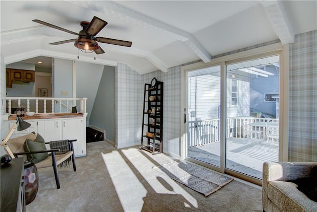 interior space with ceiling fan and light colored carpet