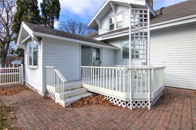 doorway to property featuring a wooden deck