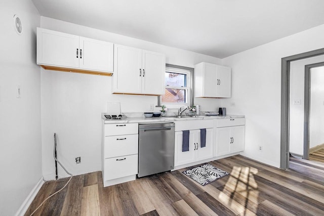 kitchen with dishwasher, dark hardwood / wood-style floors, white cabinetry, and sink