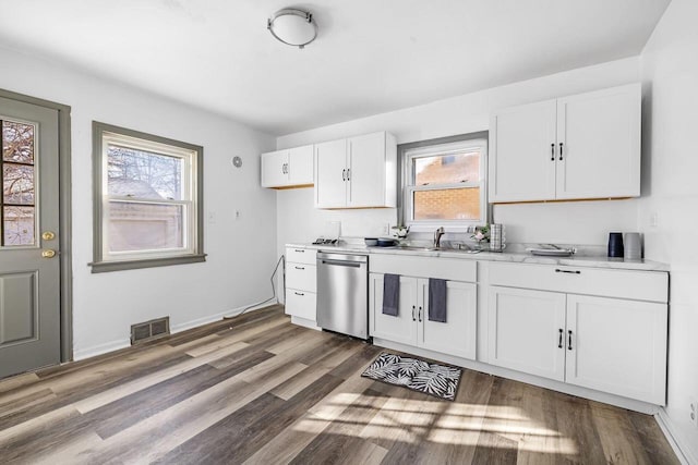 kitchen with white cabinetry, dishwasher, dark wood-type flooring, and sink