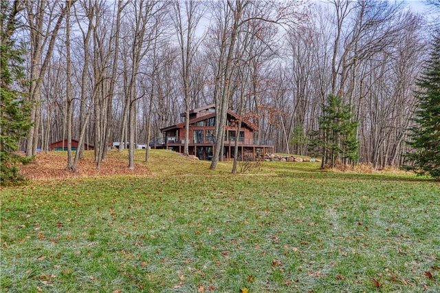 view of yard with a wooden deck