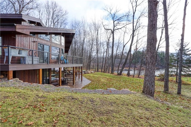 view of yard with a deck and a patio area