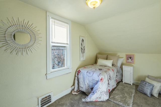 bedroom with carpet and vaulted ceiling