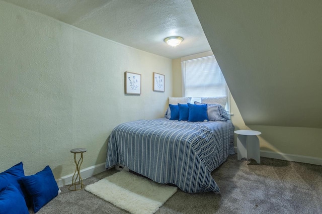 carpeted bedroom featuring a textured ceiling