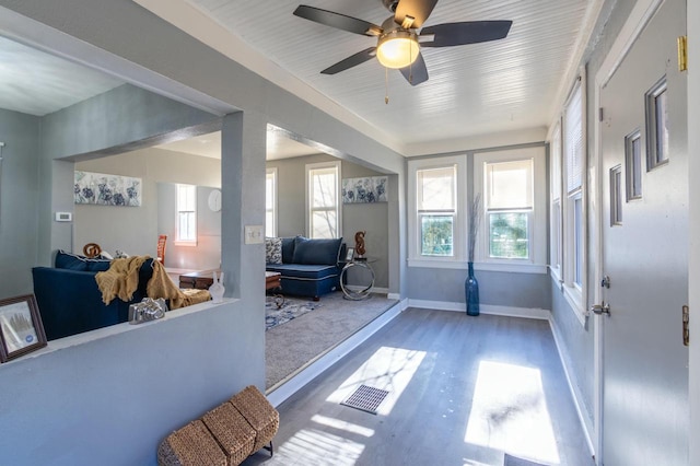 interior space featuring ceiling fan and a healthy amount of sunlight