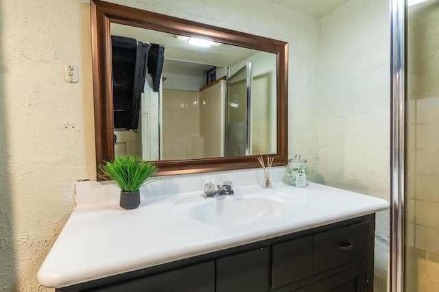 bathroom featuring vanity and walk in shower