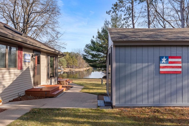 exterior space with a yard and a water view