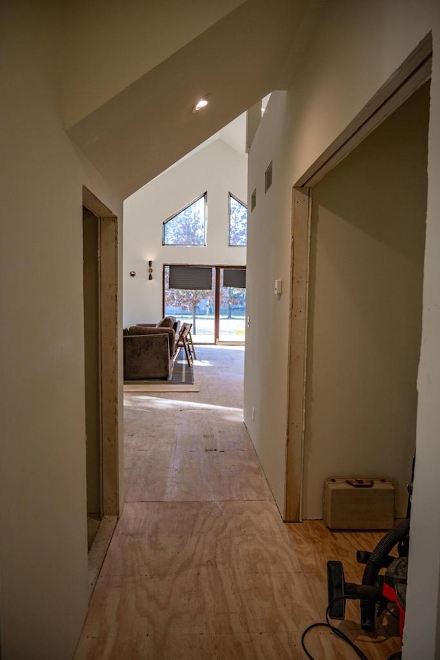 hall featuring high vaulted ceiling