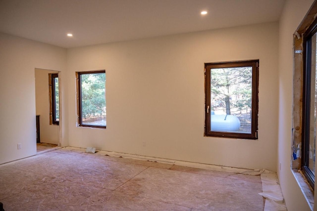 unfurnished room featuring a wealth of natural light