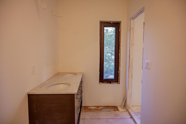 bathroom with vanity and a healthy amount of sunlight