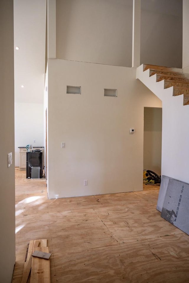 unfurnished room with a high ceiling