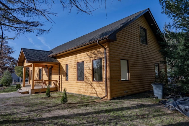 view of property exterior with a porch and a wooden deck