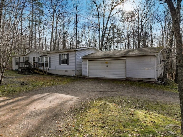 view of front of house with a garage and a deck