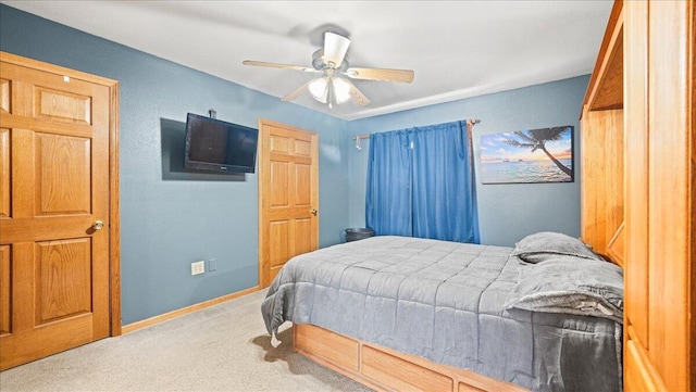 bedroom featuring ceiling fan and carpet floors