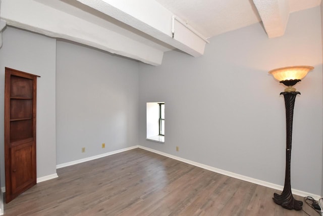 unfurnished room featuring dark hardwood / wood-style floors