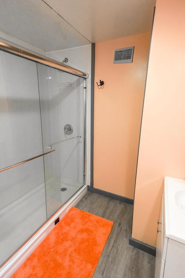 N9128 Snow Snake Trl, Necedah, WI 54646 - full bath with wood finished floors, a stall shower, and vanity