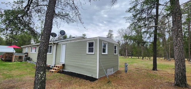 N9128 Snow Snake Trl, Necedah, WI 54646 - view of property exterior with entry steps and a yard