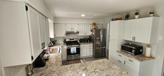 kitchen with white cabinets, sink, dark wood-type flooring, and appliances with stainless steel finishes