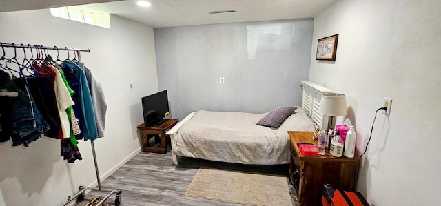 bedroom featuring hardwood / wood-style floors