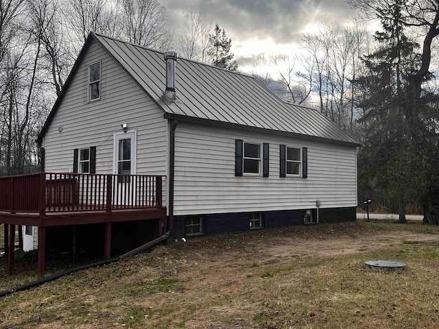 rear view of property with a wooden deck