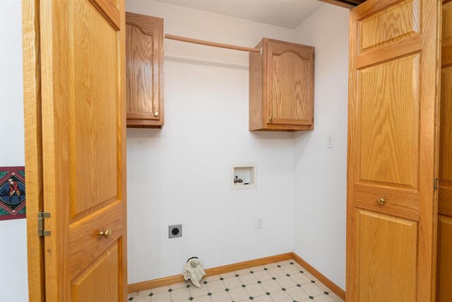 laundry area with hookup for a washing machine, electric dryer hookup, and cabinets