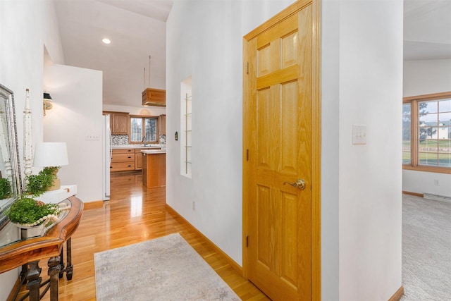 corridor featuring light hardwood / wood-style floors