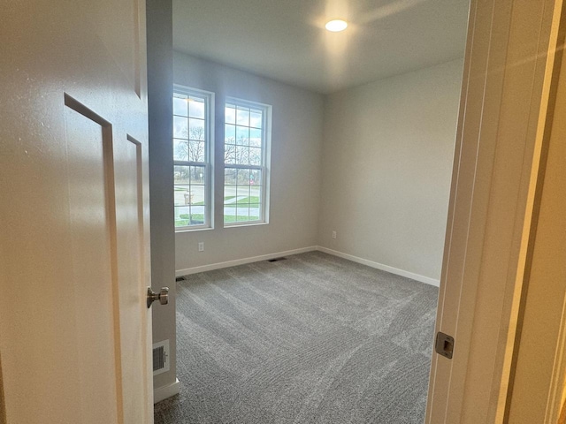 view of carpeted spare room