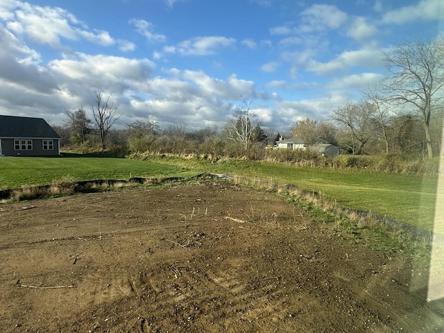 view of yard with a rural view