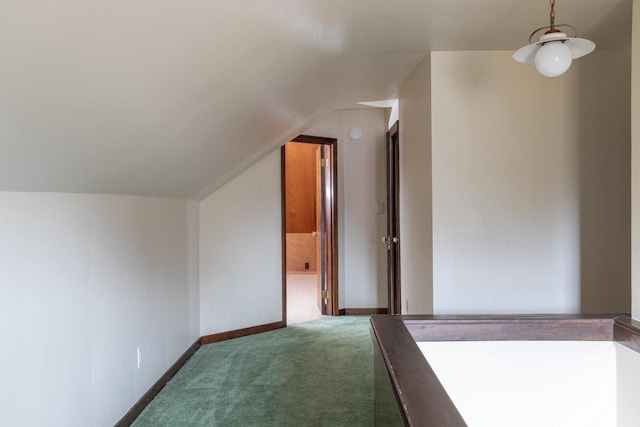 bonus room featuring carpet floors and vaulted ceiling