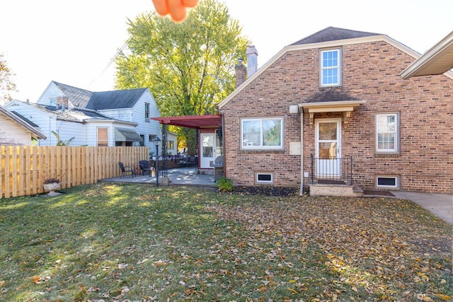 view of front of house with a front lawn and a patio