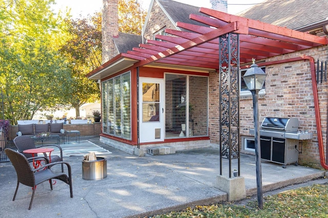 view of patio / terrace with a sunroom, a pergola, and grilling area