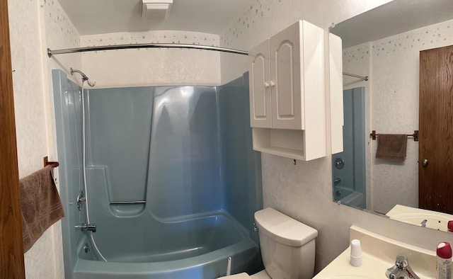 full bathroom featuring vanity, shower / bath combination, and toilet