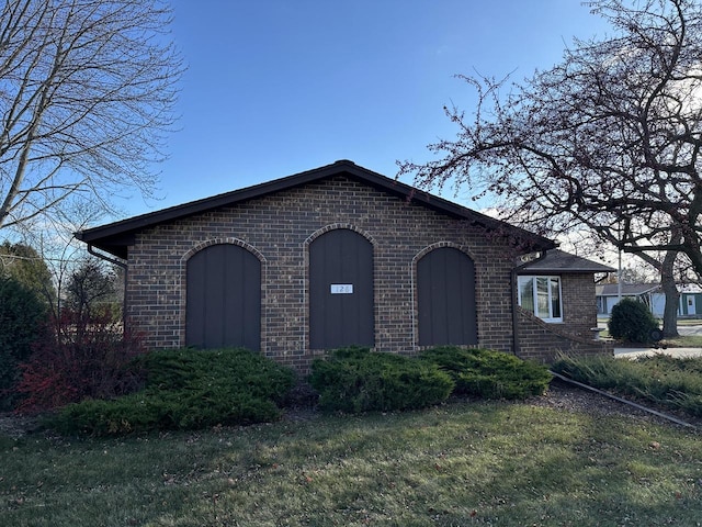 view of home's exterior with a lawn