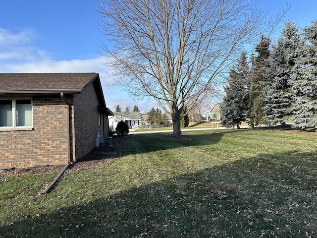 view of yard featuring central AC unit