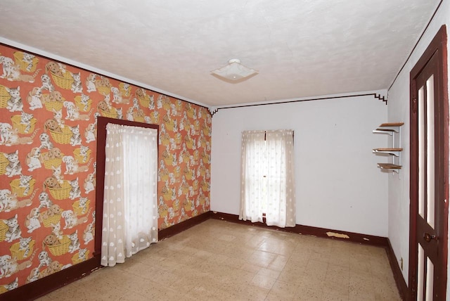 unfurnished room with a textured ceiling