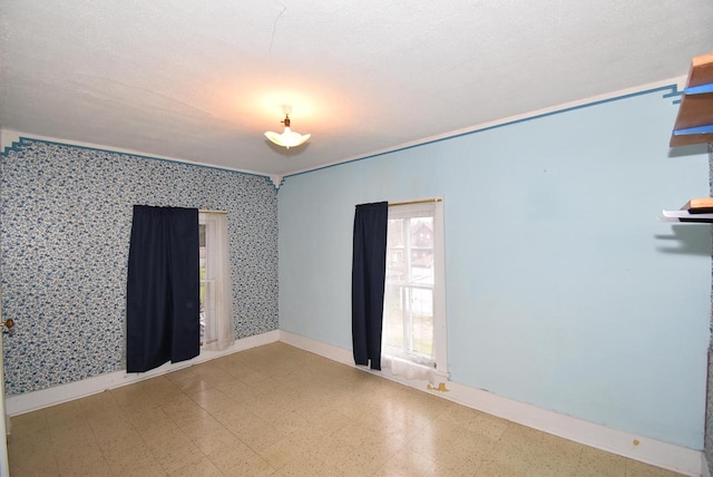 spare room featuring a textured ceiling