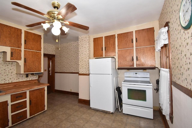 kitchen with ceiling fan, white appliances, and ornamental molding