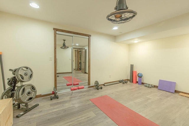 workout room with hardwood / wood-style floors