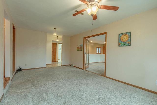 carpeted empty room with ceiling fan