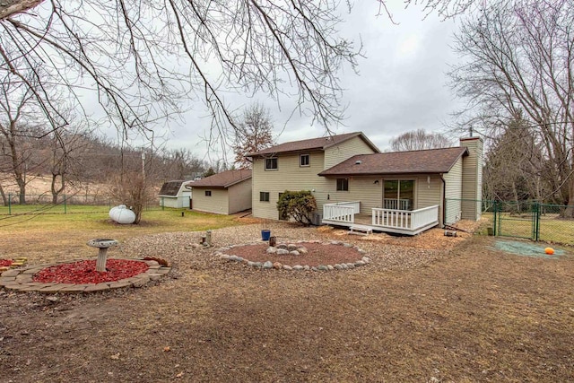 back of property featuring a deck