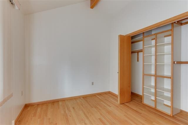 empty room featuring wood-type flooring