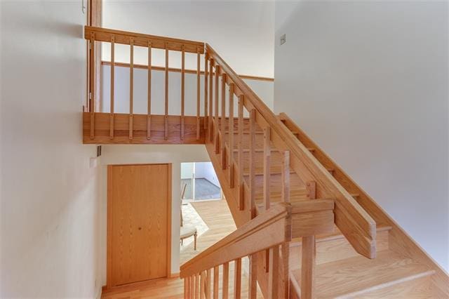 staircase featuring hardwood / wood-style flooring