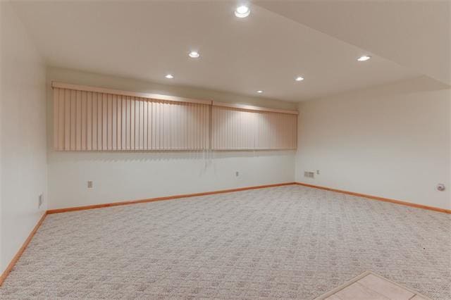 empty room featuring light colored carpet