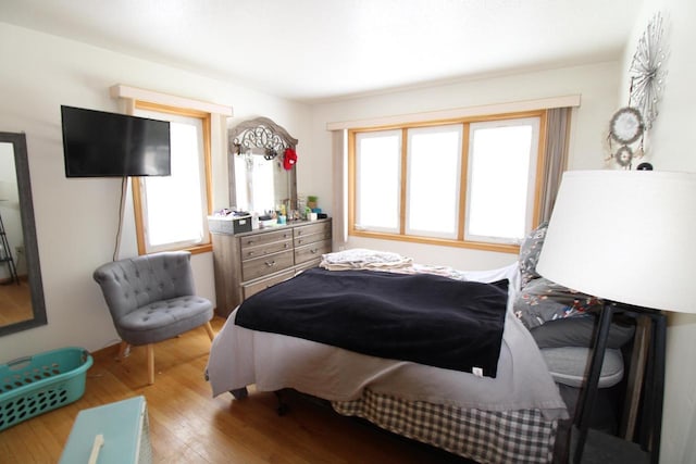 bedroom with light hardwood / wood-style flooring