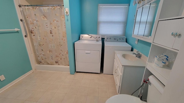 laundry room featuring sink and washing machine and clothes dryer