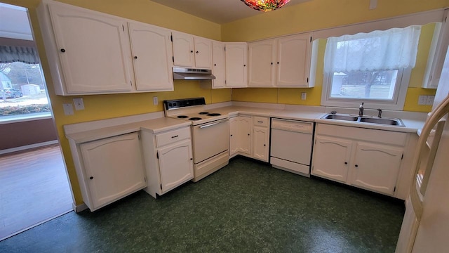 kitchen with white cabinets, a healthy amount of sunlight, white appliances, and sink