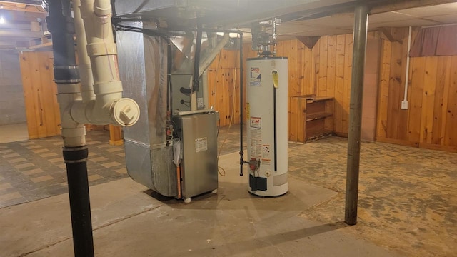 basement with wooden walls and water heater