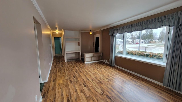 interior space with crown molding and hardwood / wood-style floors