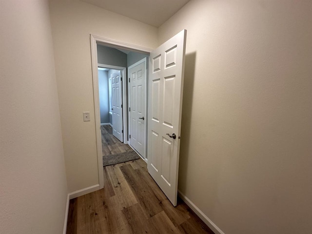 hallway featuring dark hardwood / wood-style floors