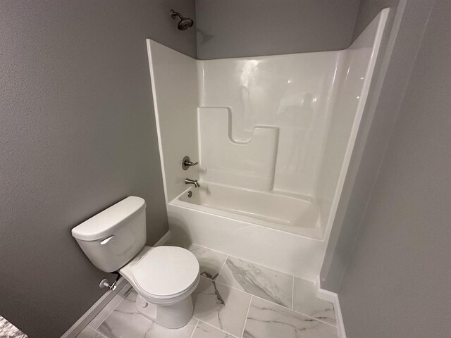 bathroom with toilet and tub / shower combination